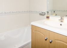 Apartment bathroom with bath