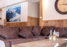 A comfy sofa in the lounge of Chalet Mira